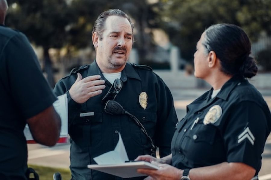 a group of police officers chatting. 